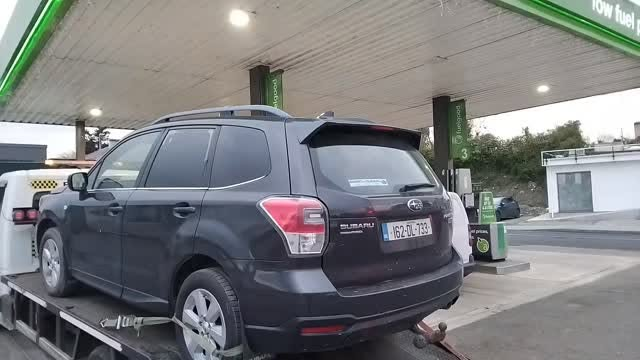 Subaru Forester on the truck, fuelled up and heading home.